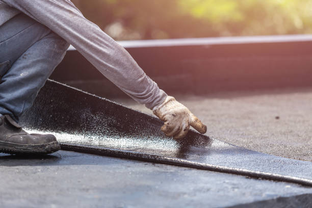 Professional Basement Waterproofing technician working in Darby, PA